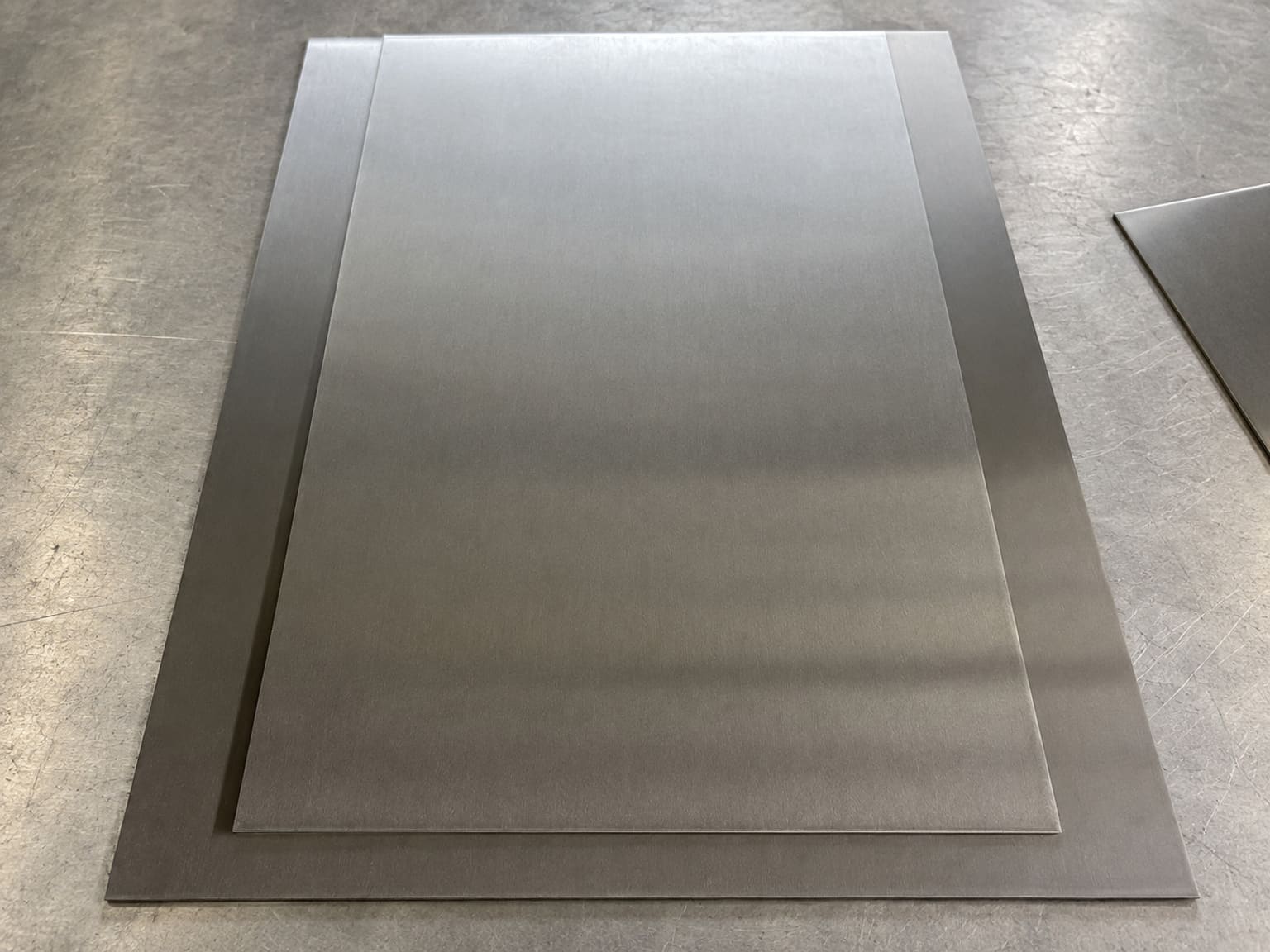 Stacked brushed metal plates